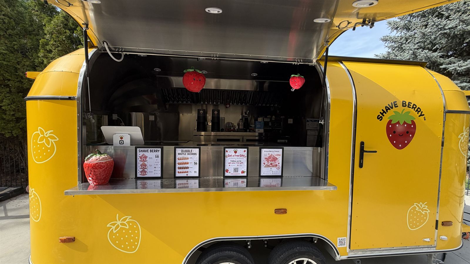 Shave Berry trailer with serving window open, ready to serve desserts